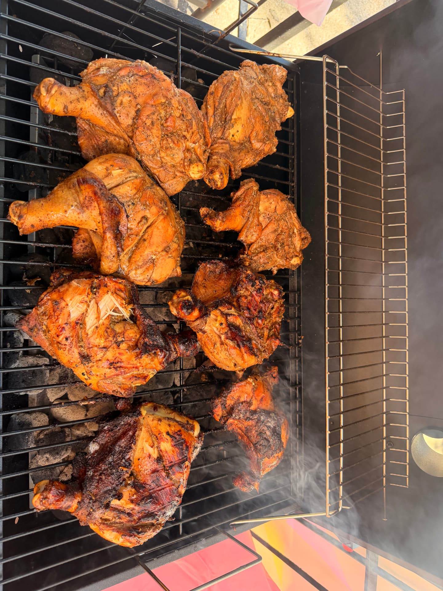Jerk chicken sizzling on the grill