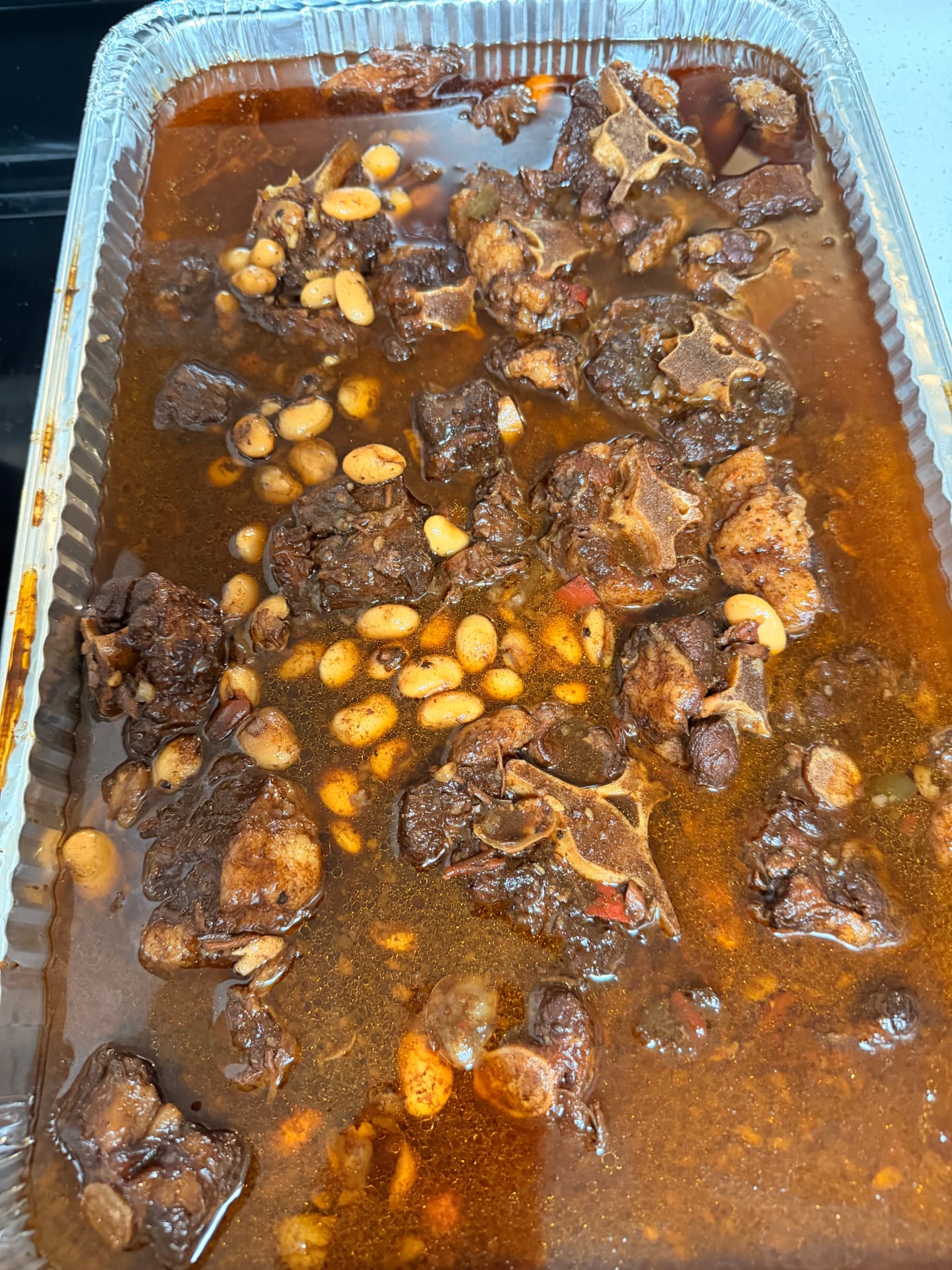 Slow-stewed oxtail with butter beans